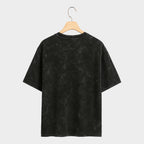 Black marble-patterned t-shirt on a light gray background