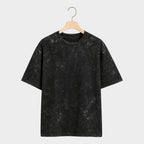 Black marble-textured t-shirt on a light gray background