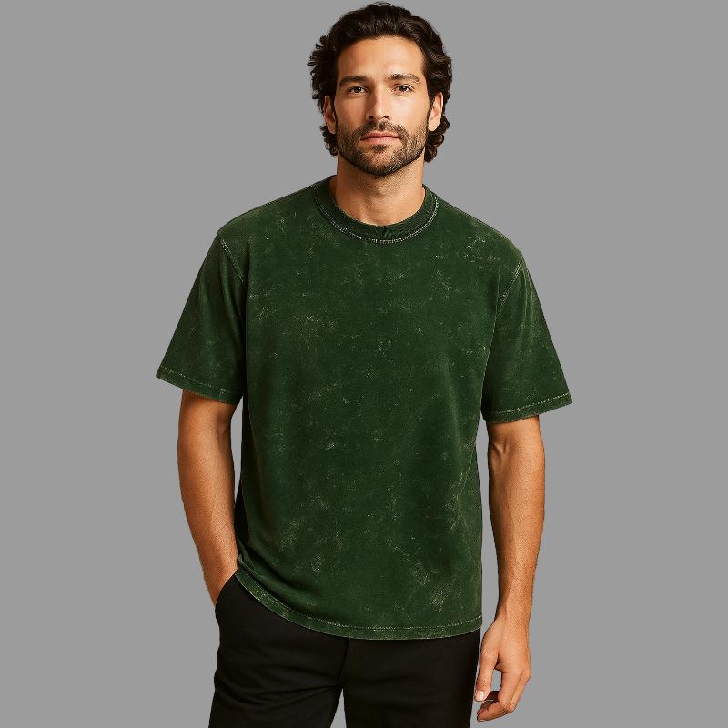 Man wearing a green t-shirt against a gray background