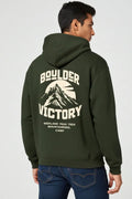 Person wearing a green hoodie with 'Boulder Victory' text and mountain graphic on the back.