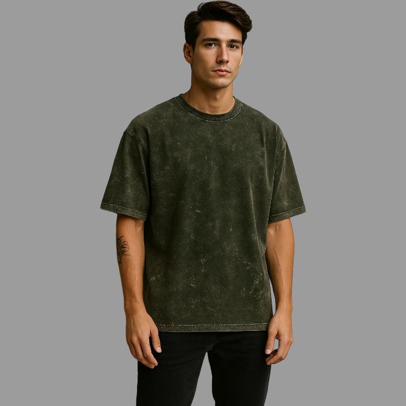 Man wearing a green t-shirt against a gray background