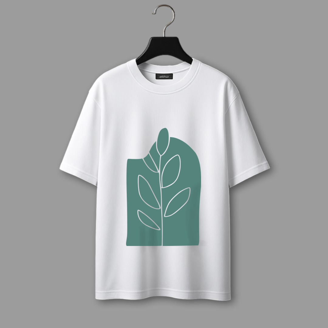 White t-shirt with green leaf design on a hanger against a dark background