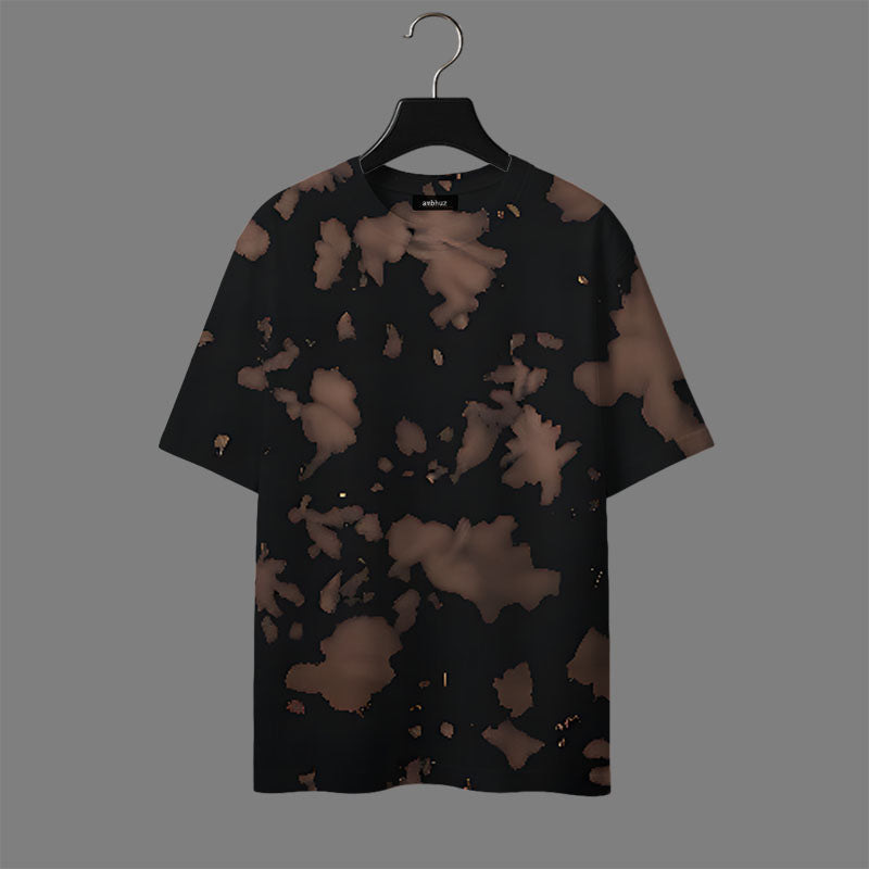 Black t-shirt with brown abstract pattern on a hanger against a gray background