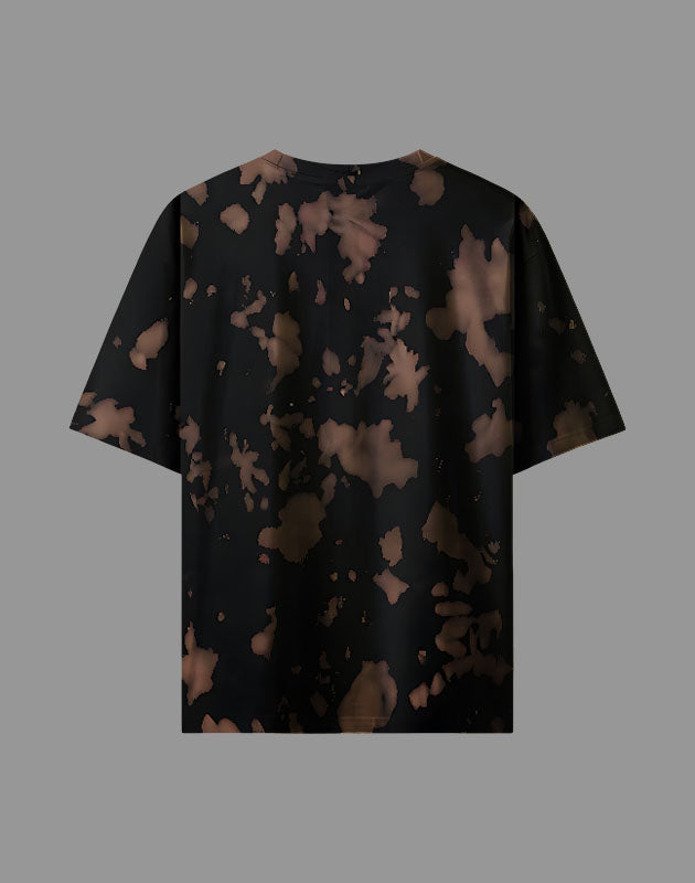 Black t-shirt with abstract brown pattern on a gray background