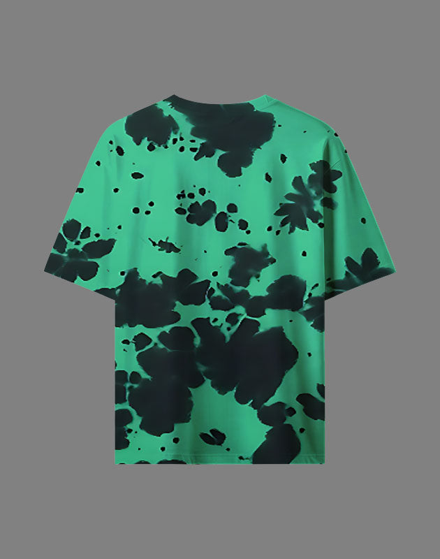 Green t-shirt with black abstract pattern on a gray background