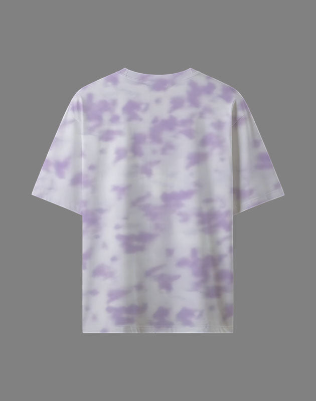 Tie-dye t-shirt with purple and white pattern on a gray background