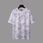 White t-shirt with purple cloud pattern on a hanger against a gray background