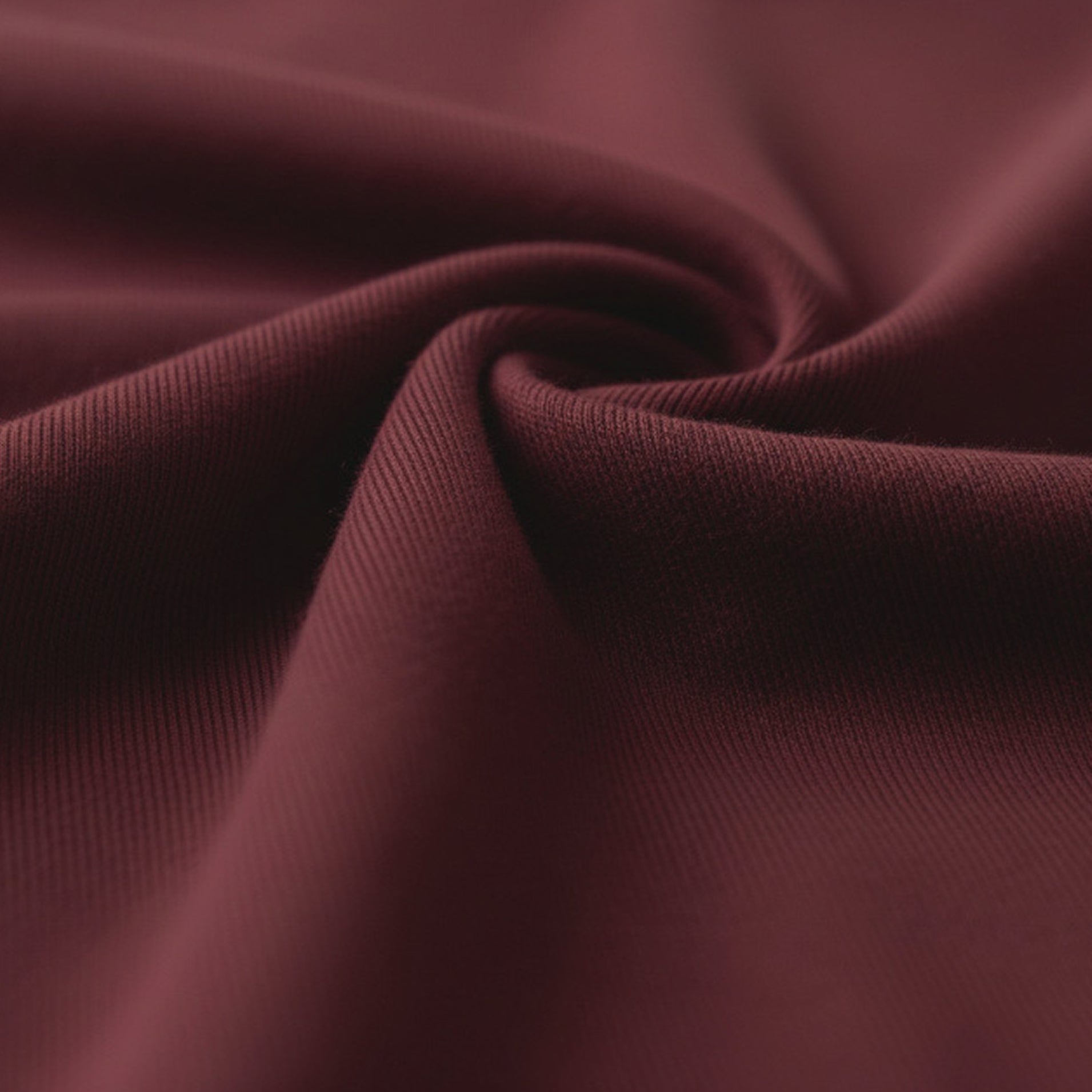 Close-up of dark red fabric with a blurred background