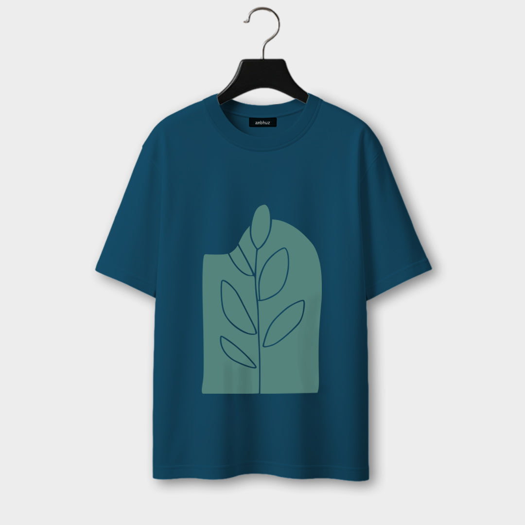 Blue t-shirt with a green leaf design on a hanger against a white background